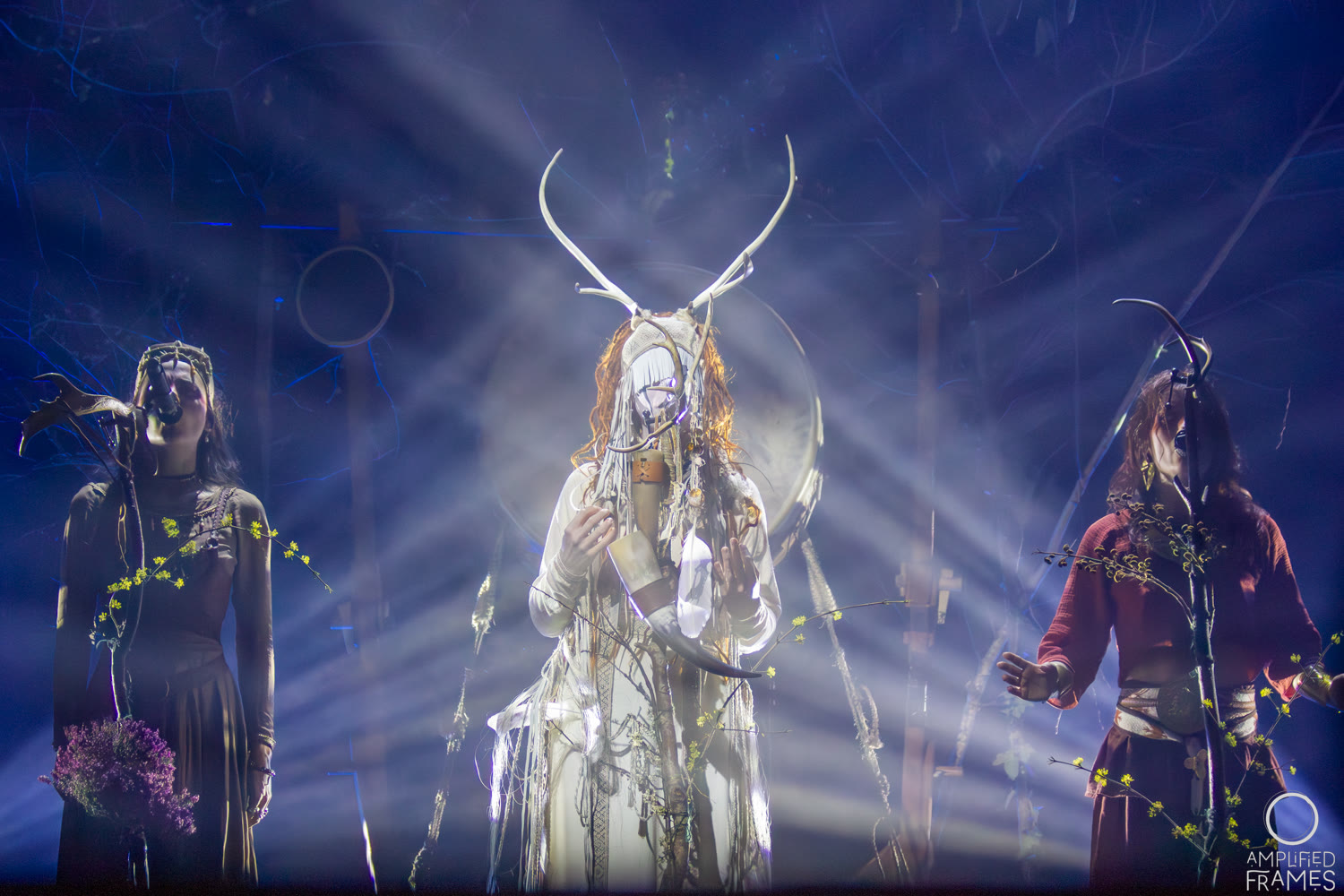 Heilung performing a ritual stage show with vocalist Maria Franz at the front